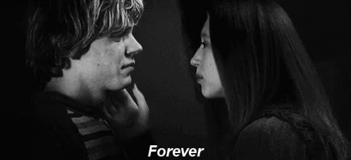 A Black And White Photo Of A Man 'S Face With The Words `` Forever '' Written Above Him . GIF