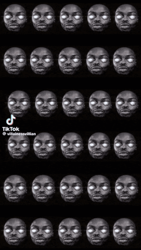 A Black And White Photo Of A Man 'S Face With White Eyes And Teeth . GIF