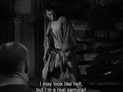A Black And White Photo Of A Man Saying " I May Look Like Hell " GIF