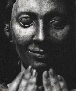 A Black And White Photo Of A Man Screaming With His Mouth Wide Open GIF
