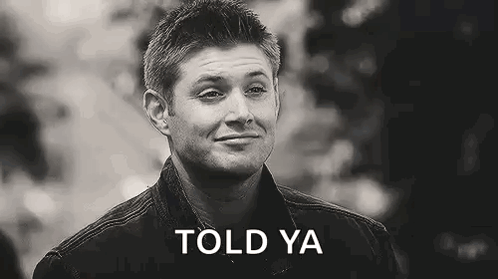 a black and white photo of a man smiling with the words `` told ya '' written on the bottom .