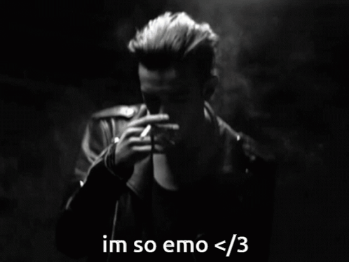 A Black And White Photo Of A Man Smoking A Cigarette With The Caption Im So Emo < 3 GIF