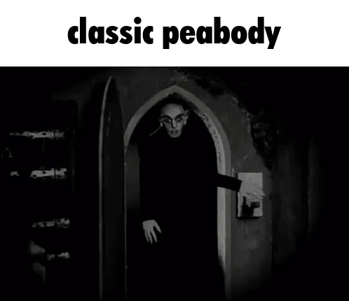 a black and white photo of a man standing in a doorway with the caption classic peabody