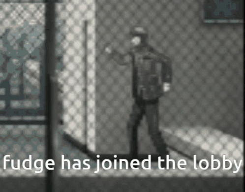 A Black And White Photo Of A Man Standing In Front Of A Chain Link Fence With The Caption Fudge Has Joined The Lobby . GIF
