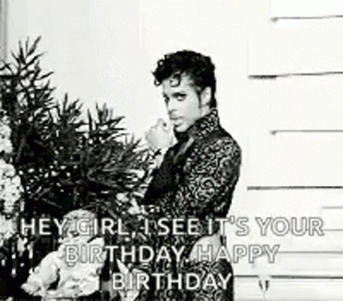 A Black And White Photo Of A Man Standing In Front Of A Christmas Tree With A Birthday Message . GIF