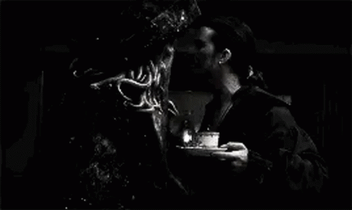 A Black And White Photo Of A Man Standing Next To A Monster In A Pirate Costume . GIF