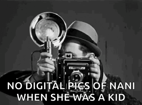 A Black And White Photo Of A Man Taking A Picture Of A Woman With A Camera . GIF