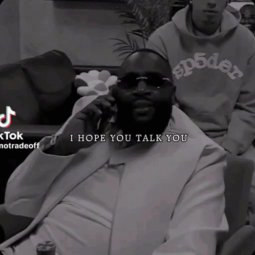 A Black And White Photo Of A Man Talking On A Phone With The Caption " I Hope You Talk You " GIF