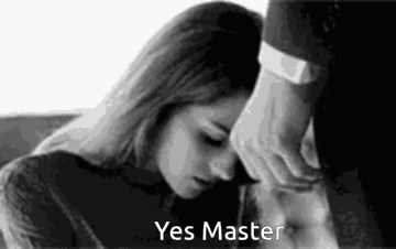 A Black And White Photo Of A Man Touching A Woman 'S Forehead . GIF