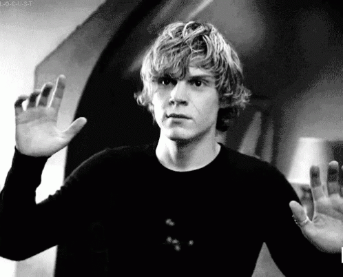 A Black And White Photo Of A Man Waving His Hand GIF