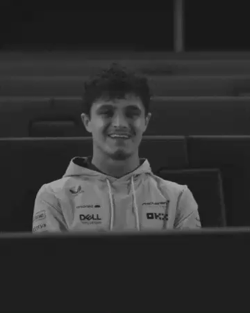 a black and white photo of a man wearing a dell sweatshirt