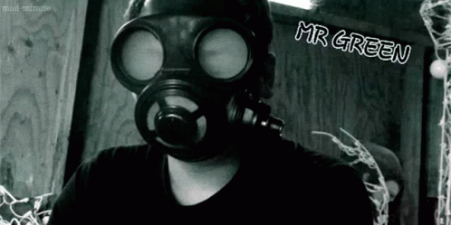 A Black And White Photo Of A Man Wearing A Gas Mask With Mr Green Written On The Bottom GIF