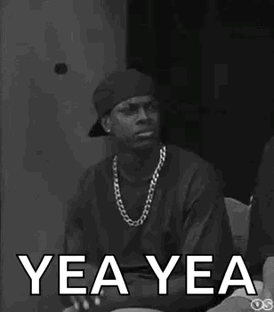 A Black And White Photo Of A Man Wearing A Hat And A Necklace With The Words Yea Yea Written On It . GIF