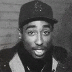 A Black And White Photo Of A Man Wearing A Hat And A Turtleneck . GIF