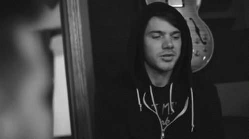A Black And White Photo Of A Man Wearing A Shirt That Says ' I Am ' GIF