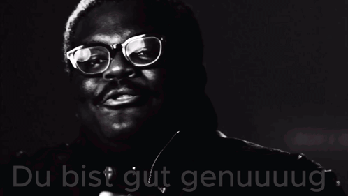 A Black And White Photo Of A Man Wearing Glasses And The Words Du Bist Gut Genuuug GIF