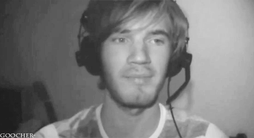 A Black And White Photo Of A Man Wearing Headphones And A Goocher Logo GIF