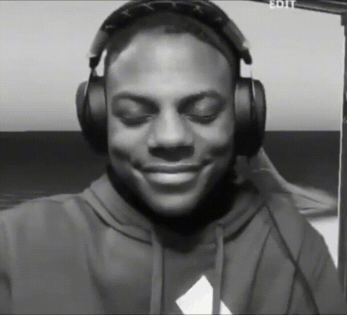 a black and white photo of a man wearing headphones with the word edit visible in the corner