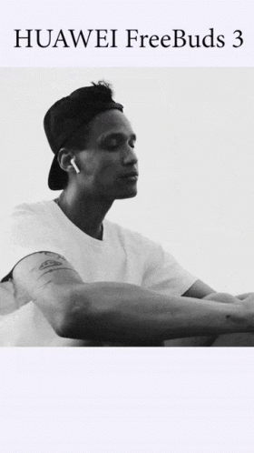 A Black And White Photo Of A Man Wearing Huawei Freebuds 3 Earbuds GIF