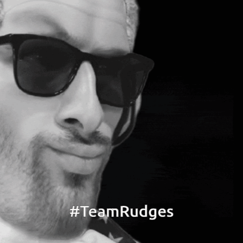 A Black And White Photo Of A Man Wearing Sunglasses And The Words #Teamrudges On The Bottom GIF