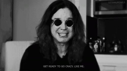 A Black And White Photo Of A Man Wearing Sunglasses GIF
