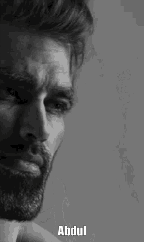 A Black And White Photo Of A Man With A Beard And The Name Abdul Written On His Face . GIF