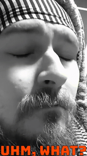 A Black And White Photo Of A Man With A Beard And The Words Uhm What On The Bottom GIF