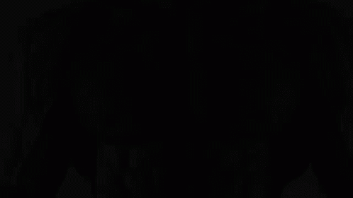 A Black And White Photo Of A Man With A Beard GIF