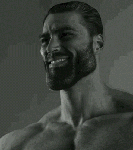 A Black And White Photo Of A Man With A Beard Smiling . GIF