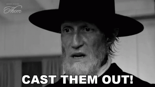 A Black And White Photo Of A Man With A Beard Wearing A Hat . GIF