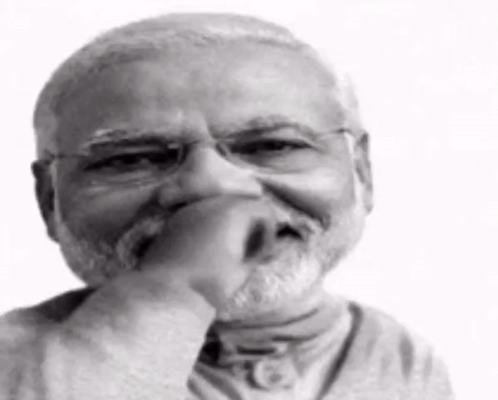 A Black And White Photo Of A Man With A Beard Wearing Glasses . GIF