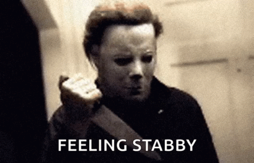 A Black And White Photo Of A Man With A Mask And The Words Feeling Stabby GIF