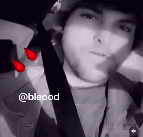 A Black And White Photo Of A Man With Blood Drops On His Face GIF