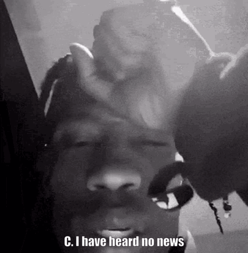 A Black And White Photo Of A Man With Dreadlocks Holding His Hand To His Forehead . GIF