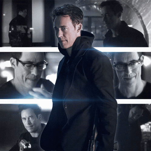 A Black And White Photo Of A Man With Glasses And A Black Jacket GIF