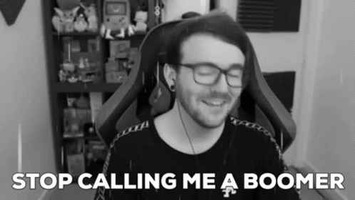 A Black And White Photo Of A Man With Glasses And The Words " Stop Calling Me A Boomer " Behind Him GIF