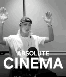 A Black And White Photo Of A Man With His Hands In The Air And The Words Absolute Cinema Below Him GIF