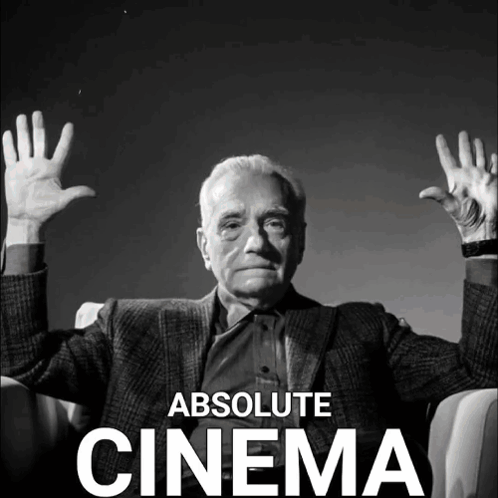 A Black And White Photo Of A Man With His Hands In The Air And The Words Absolute Cinema Below Him GIF