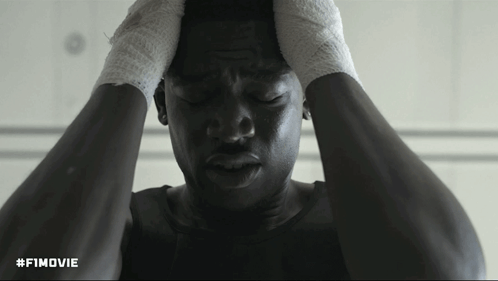 A Black And White Photo Of A Man With His Hands On His Head With The Hashtag #Fimovie GIF