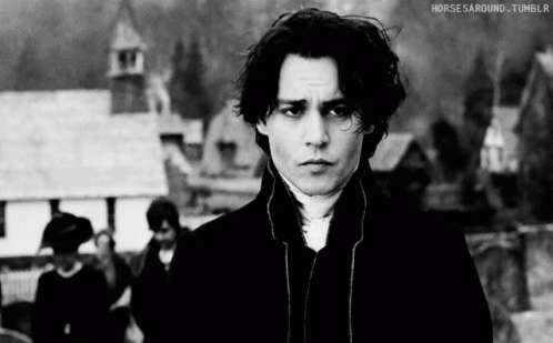 A Black And White Photo Of A Man With Horses Around Tumblr Written Below Him GIF