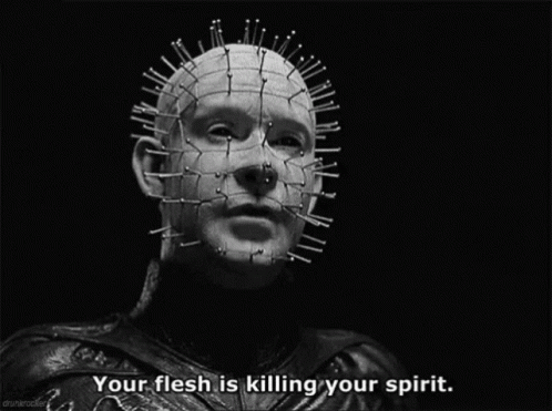 a black and white photo of a man with spikes on his head and the caption your flesh is killing your spirit