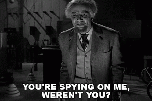 a black and white photo of a man with the caption " you 're spying on me weren 't you "