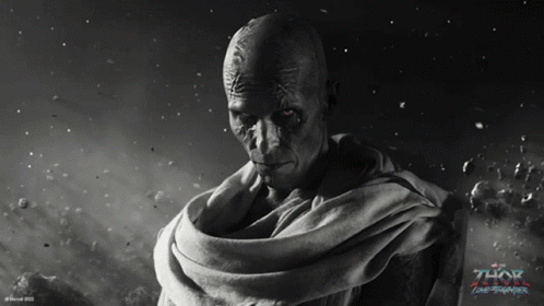 a black and white photo of a man with the word thor on the bottom