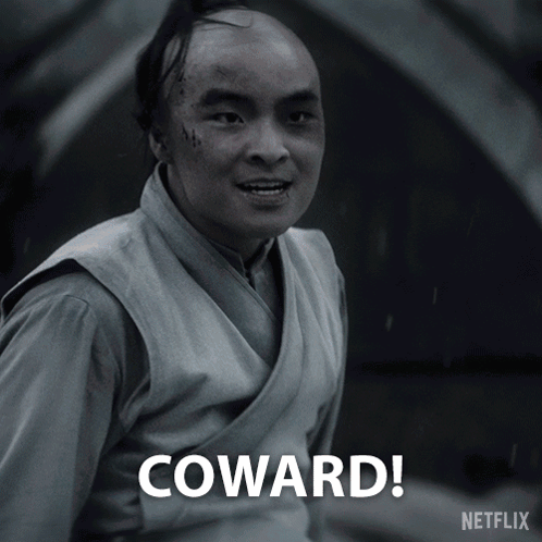 A Black And White Photo Of A Man With The Words Coward Written Below Him GIF