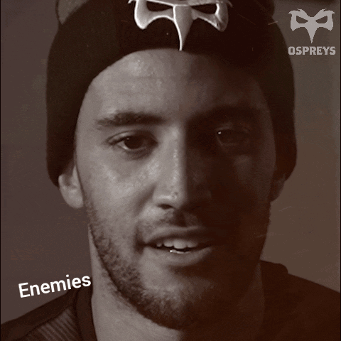 A Black And White Photo Of A Man With The Words Enemies On The Bottom Right GIF