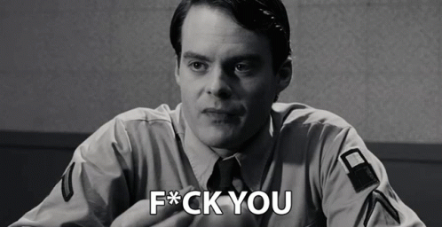 A Black And White Photo Of A Man With The Words F * Ck You On His Chest GIF