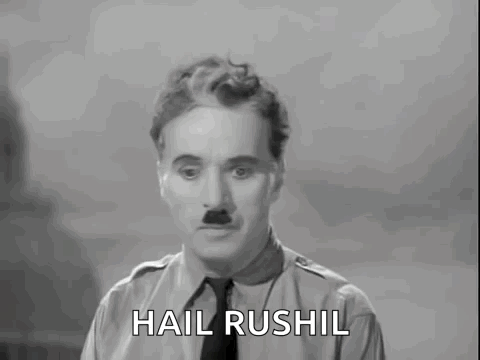 A Black And White Photo Of A Man With The Words Hail Rushil Above Him GIF