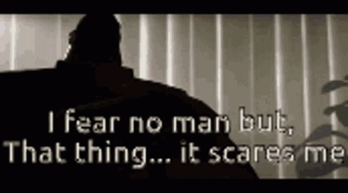 A Black And White Photo Of A Man With The Words `` I Fear No Man But That Thing It Scares Me '' GIF