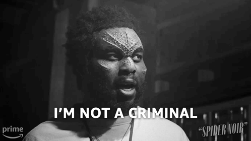 A Black And White Photo Of A Man With The Words I 'M Not A Criminal Above Him GIF