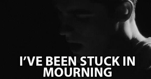 a black and white photo of a man with the words " i 've been stuck in mourning " above him